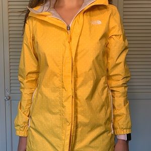 Yellow and white polka dot rain coat